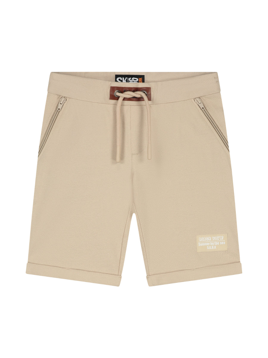 Sweatshort in het beige voor jongens van SKURK. Zomercollectie 2025