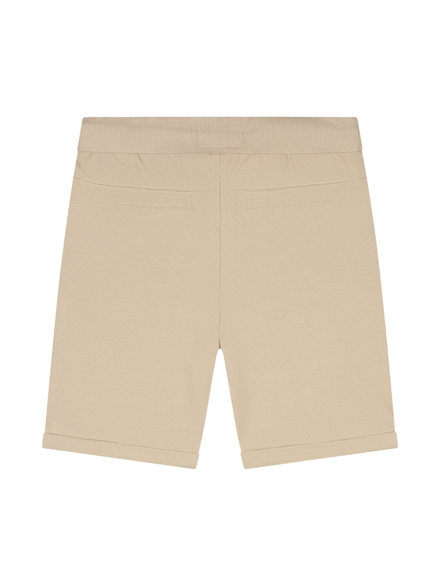 Sweatshort in het beige voor jongens van SKURK. Zomercollectie 2025